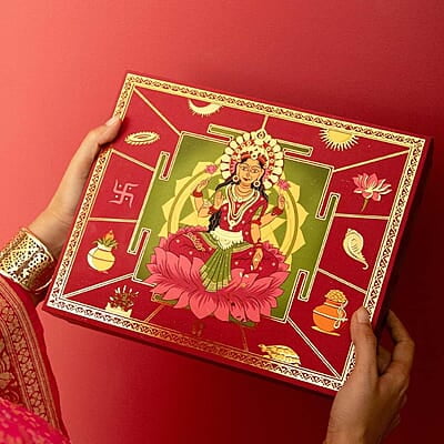 Eat Better Co Samriddhi Gift Hamper with Laxmi Design for Diwali - 11 Item Gift Pack - Dry Fruit Laddoos, Chocolate Coated Nuts with Phool Incense Cones, Golden Bell & Lanten Diya | Diwali Gifting Box